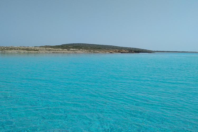 Rent a boat and explore the crystal-clear waters of Paros island.